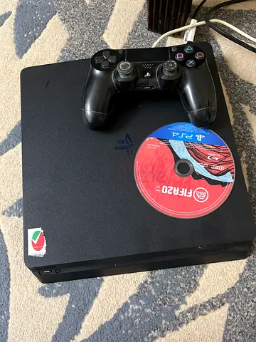 Sony PS4 Slim with DualShock controller and FIFA 20 disc
