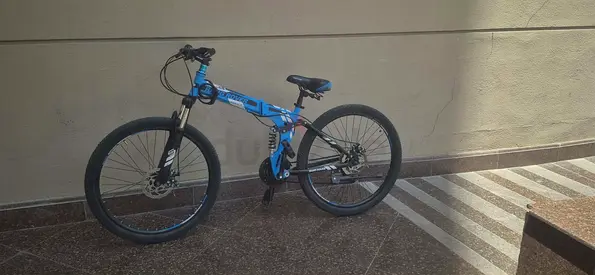 Mountain bike 200 AED with helmet price negotiable