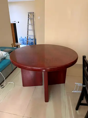 Solid round wooden dining table - 4 seater (used)