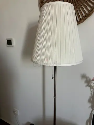 Brighten your space with this stylish and elegant lamp, perfect for any room.