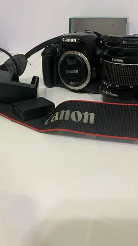 Canon EOS DSLR 1100 with 18-55mm Kit Lens, strap and charger Shutter Counter): 11,355)