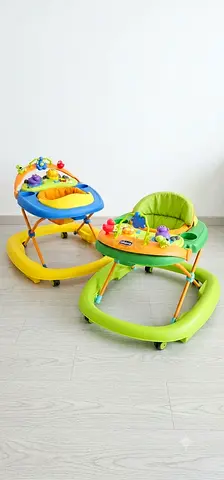 Pair of Baby Walkers with Activity Trays — Blue  Green (Good Condition).