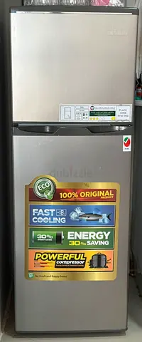 Silver double-door refrigerator - good working condition