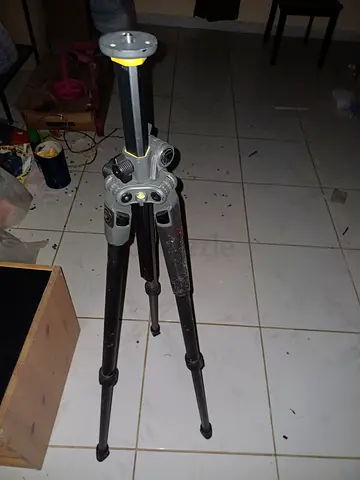 Used sturdy camera tripod with adjustable legs and pan head