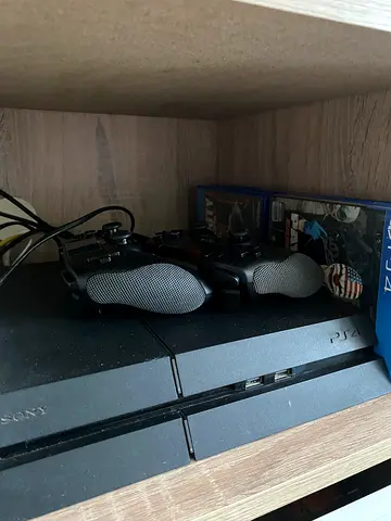 PlayStation 4 Slim with 2 Controllers and 6 games