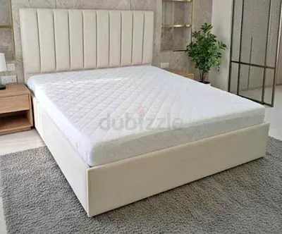 Queen size cream upholstered bed frame with headboard — good condition