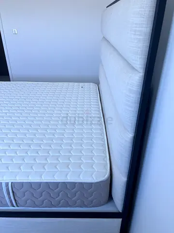 Queen mattress with upholstered bed frame - good condition