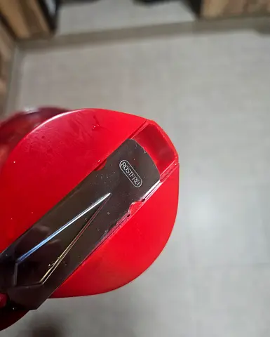 Used red syrup bottle with flip-top lid