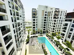 1BR + Laundry | Balcony with Pool View