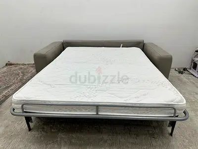 As good as new leather natuzzi two seater sofabed