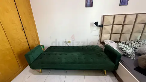 Green velvet convertible sofa bed — good condition