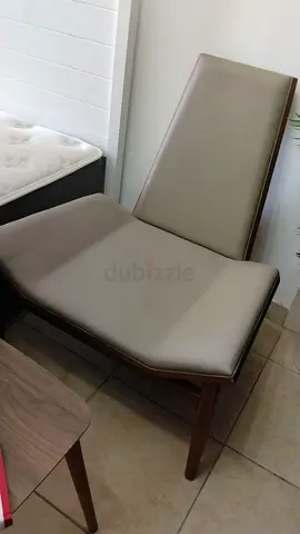 Modern armless lounge chair with faux leather upholstery