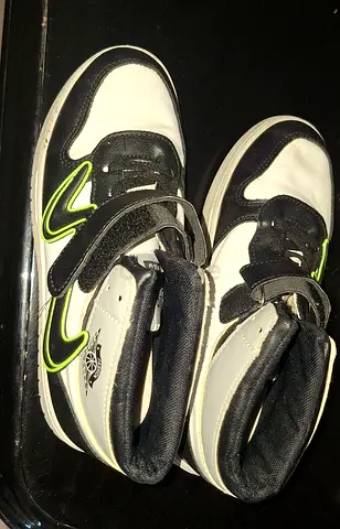 Kids white and black high-top sneakers with green accents - gently used