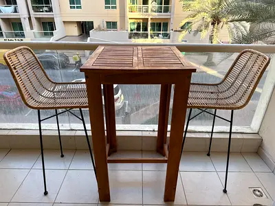 Wooden High Bistro Table with 2 Wicker Bar Stools - Good Condition (One chair lost two small bars)