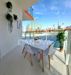 Wake Up to Burj Khalifa &amp; Canal Views | Elegant 2BR with a Grand Balcony