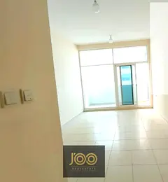 Own a 1050 sq ft unit in Ajman Towers with partial Corniche views and a garden for only AED 420,000
