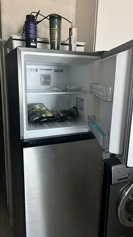 Compact top-freezer refrigerator in stainless steel - used for 3 years, very good condition