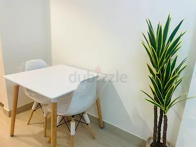 Small white dining table with two chairs - like new