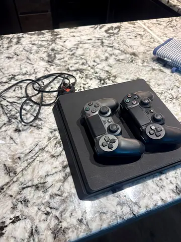 Sony PlayStation 4 Slim with Two Controllers