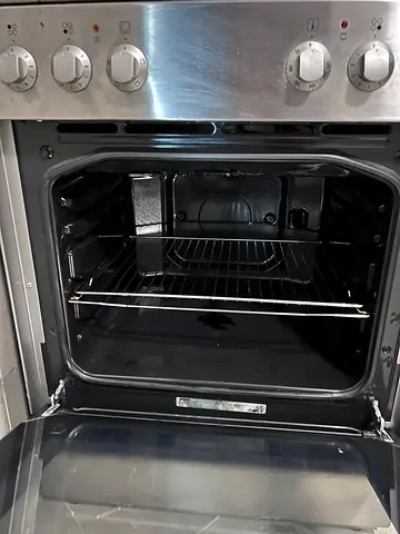 Used freestanding gas/electric oven in good working condition