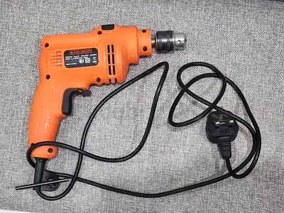 Drill machine with toolkit