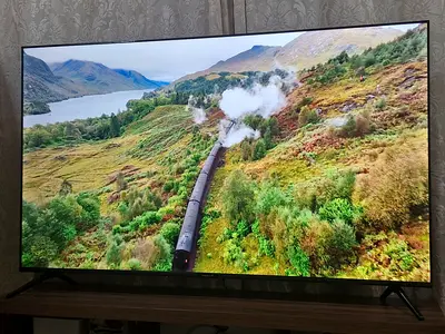 70-inch Smart LED TV UHD in excellent condition with steel stand