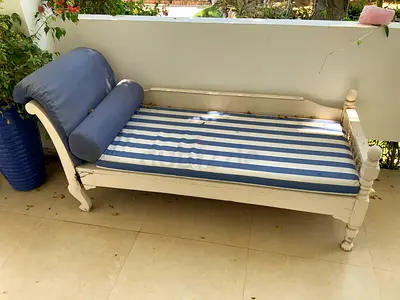 Two wooden Daybed/Chaise Lounge with Waterproof Striped Cushions. One bed needs attention.