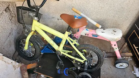 Two kids bikes — balance bike and small tricycle, used