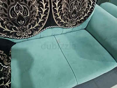 Two-seater teal fabric sofa in good condition