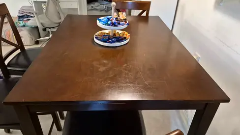 Used solid wood dining table (4-seater)