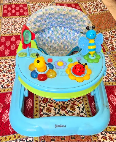 Juniors Light blue baby walker with activity tray - gently used