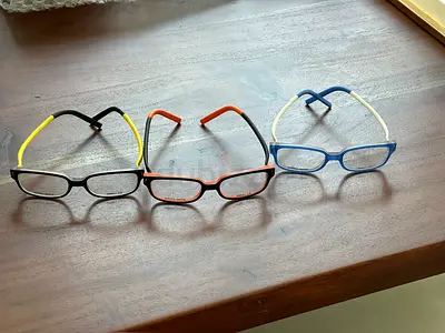 Three kids rectangular eyeglass frames – black/yellow, orange/black, blue/white