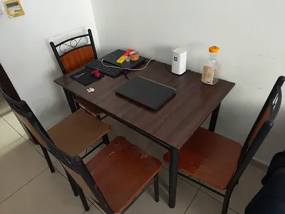 Compact 4-Seat Dining Table with Wooden Top and Metal Frame with 4 used chairs free