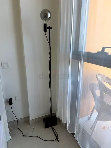 Minimalist Black Metal Floor Lamp with Exposed Bulb