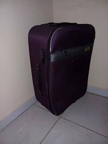 Purple medium-sized roller suitcase - good condition