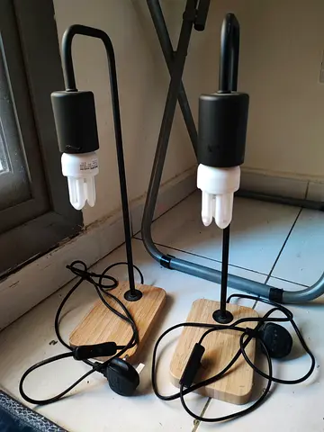 Pair of minimalist Ikea bedside/table lamps with wooden base both together 50 aed