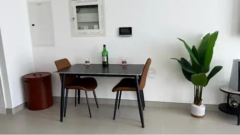 Modern Black Dining Table with Two Brown Chairs