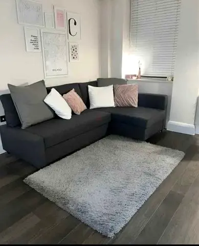 Ikea Dark Grey L-shaped Sofa with Cushions - Good Condition