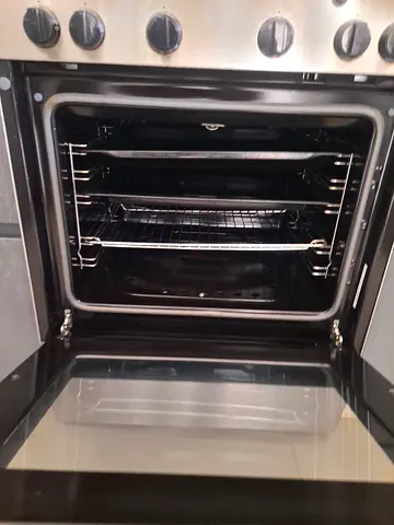 Used freestanding gas/electric oven with multiple racks - good working condition