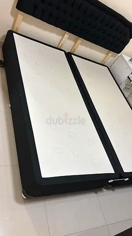 King-size divan base with twin mattresses and upholstered headboard - used
