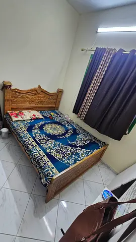 Solid Wood Double Bed with Decorative Headboard - Good Condition