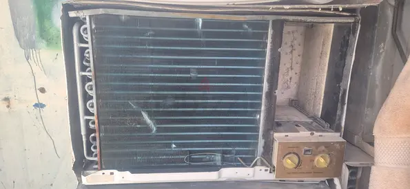 Used Window Air Conditioner Unit - Needs Repair (Evaporator Coil Visible)