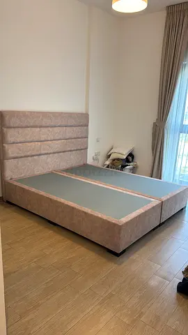 NEEDS TO GO NOW KING BED FRAME with headboard, light pink/beige. THE MATTRESS STORE