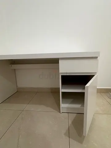 White office desk with one drawer and cabinet.