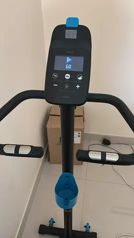 Almost-new stationary exercise bike — compact upright model