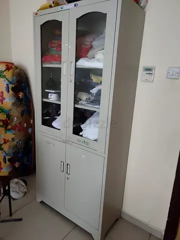 Metal storage cabinet with glass upper doors — good used condition