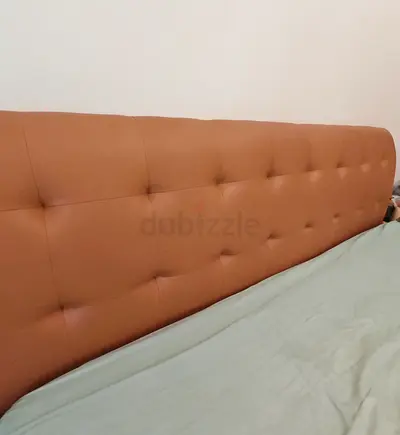 Leather king-size bed with mattress which has storage.