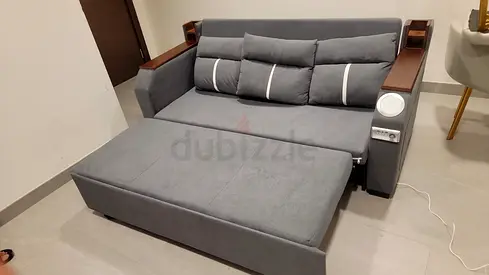 Grey Convertible Sofa Bed with Built-in Side Shelves and Speakers