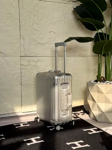 Rimowa cabin carry-on suitcase with wheels and telescopic handle