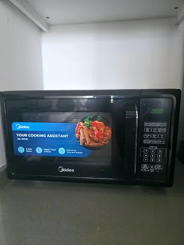 Perfect condition microwave sell because Im leaving uae